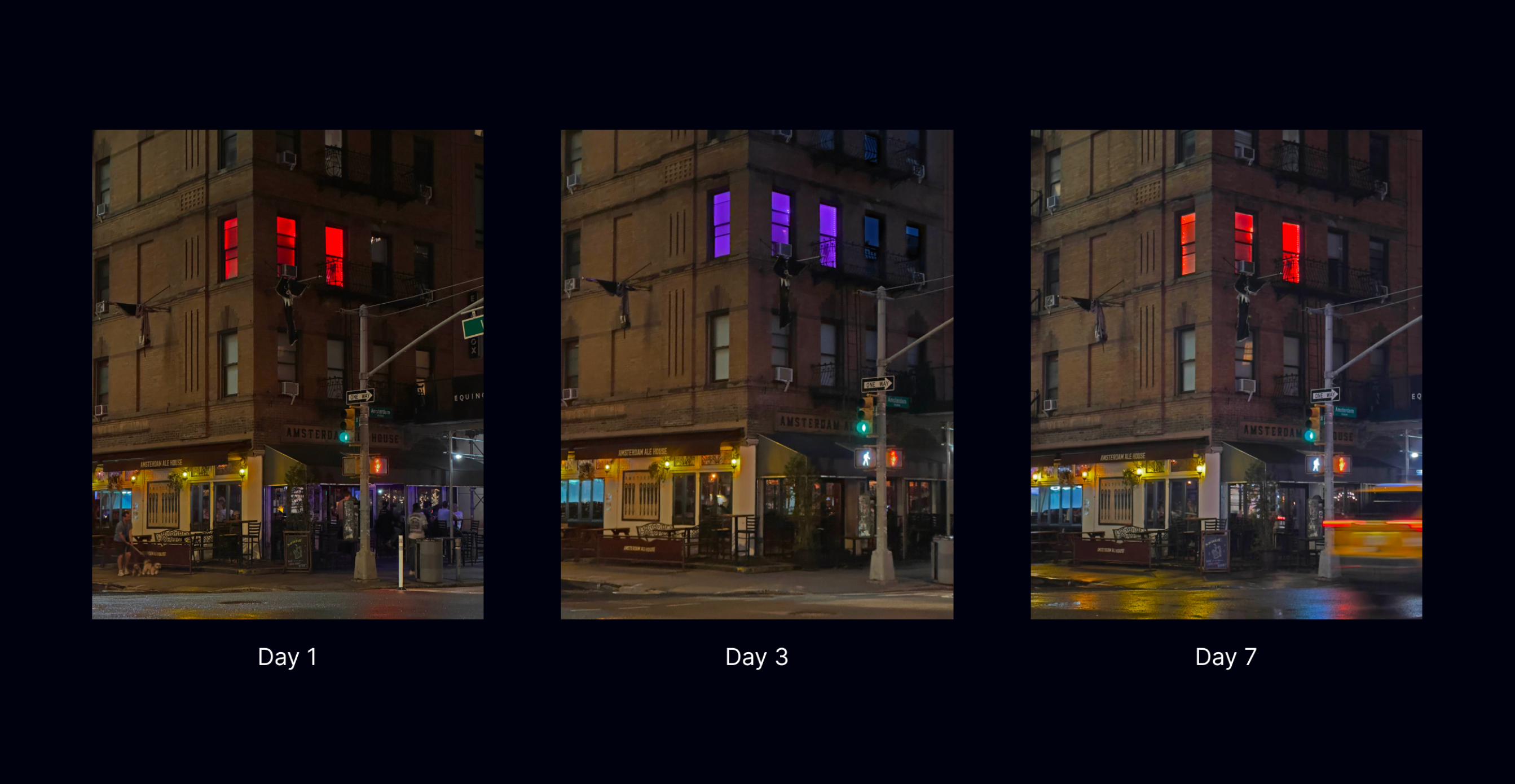 Night view from the street of three colored windows spilling light onto the sidewalk